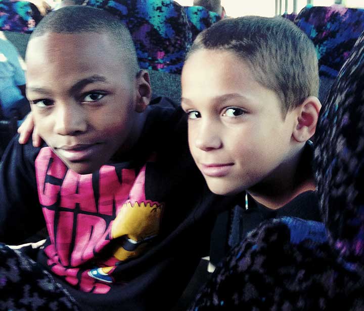 two boys on bus